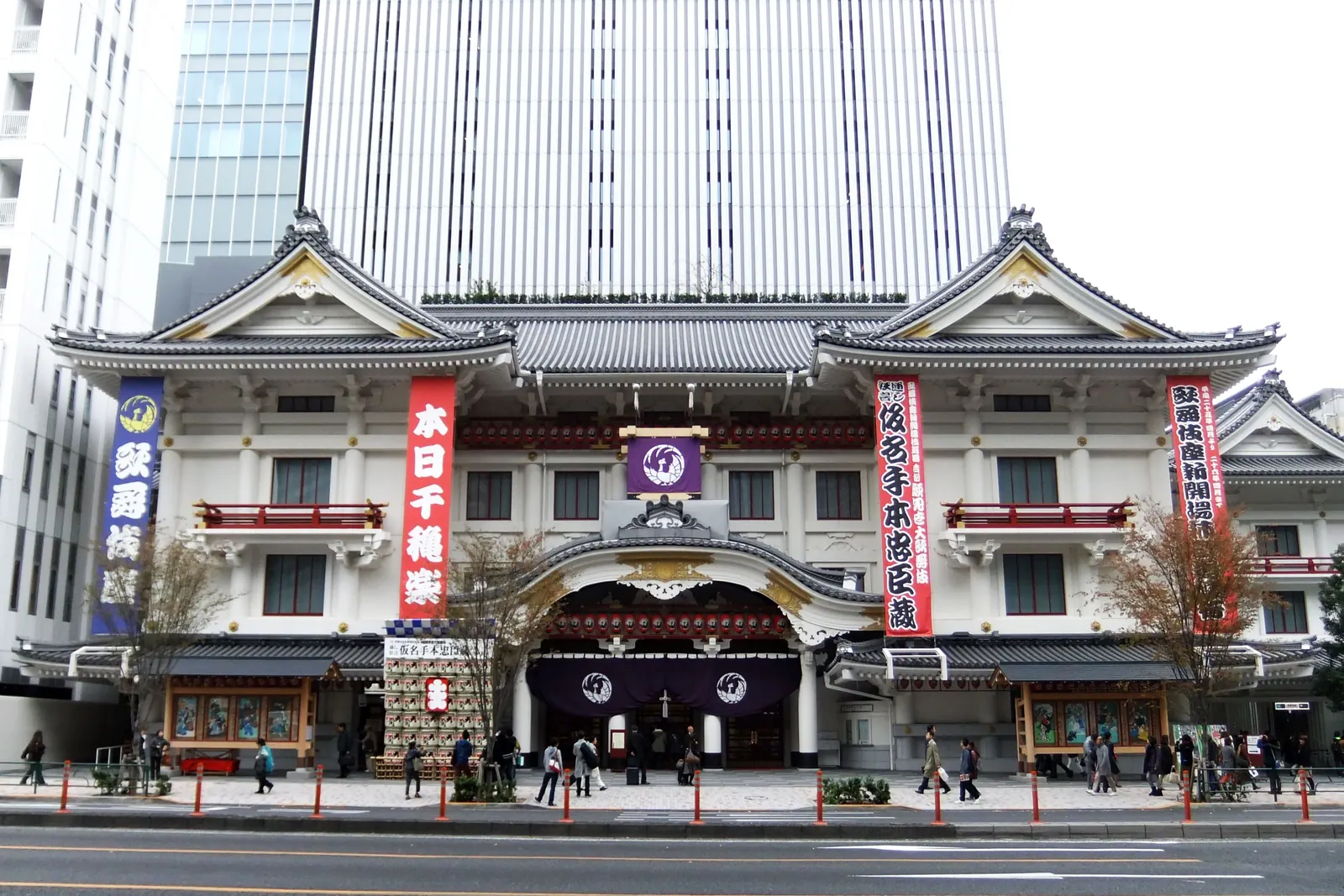The white and red front of the Kabuki-za theatre in Ginza with a tall office tower behind it; a different theatre, not the venue